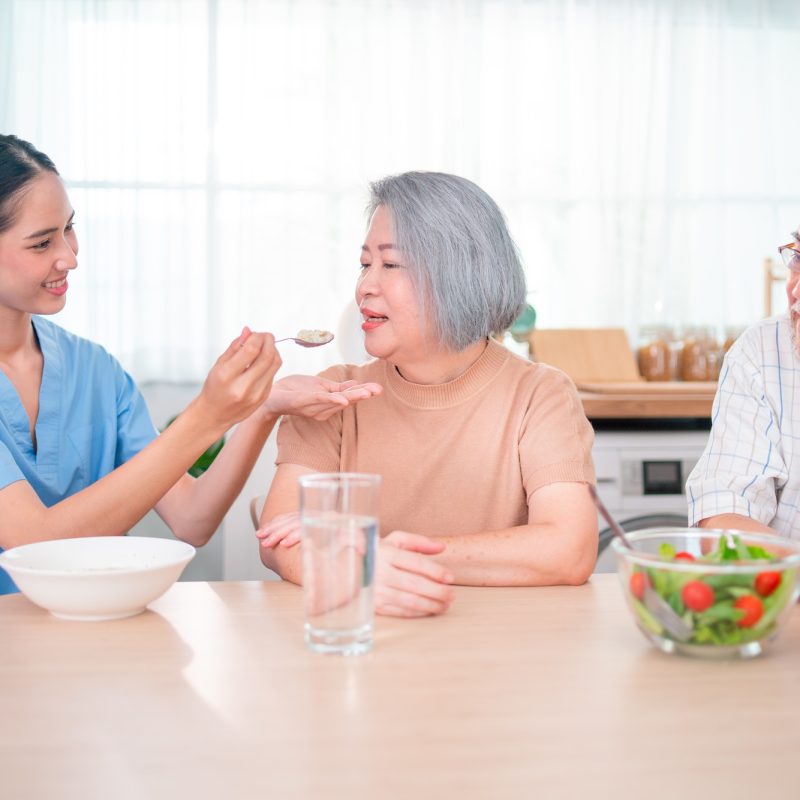 nurse-or-doctor-who-work-as-homecare-staff-help-to-serve-a-spoon-of-mush-rice-to-senior-woman.jpg nurse-or-doctor-who-work-as-homecare-staff-help-to-serve-a-spoon-of-mush-rice-to-senior-woman.jpg
